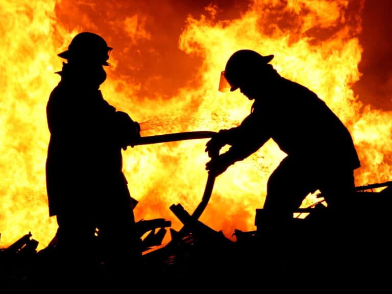 Two fire fighters and flames